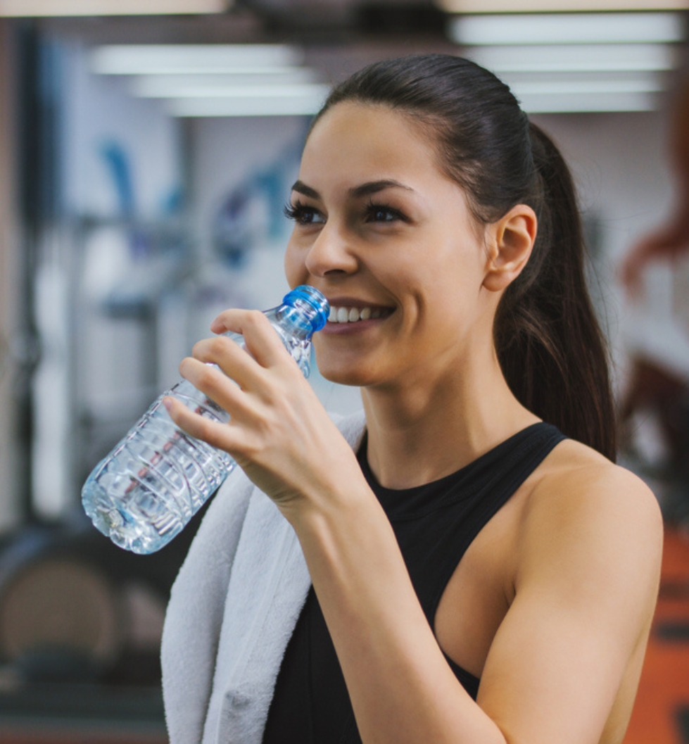 The Beach Club Residences, Minneapolis, MN - Woman hydrating after workout